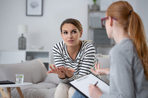 Young woman learns about a dialectical behavior therapy program