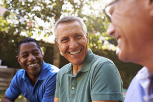 Mens Rehab Center kansas, three men smiling in agreement